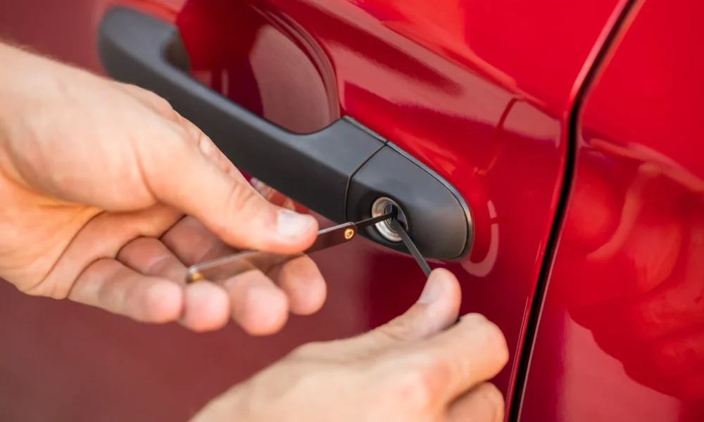person-opening-car-door-with-lockpicker